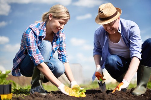 Volunteers transferring reusable soil and planters to community garden